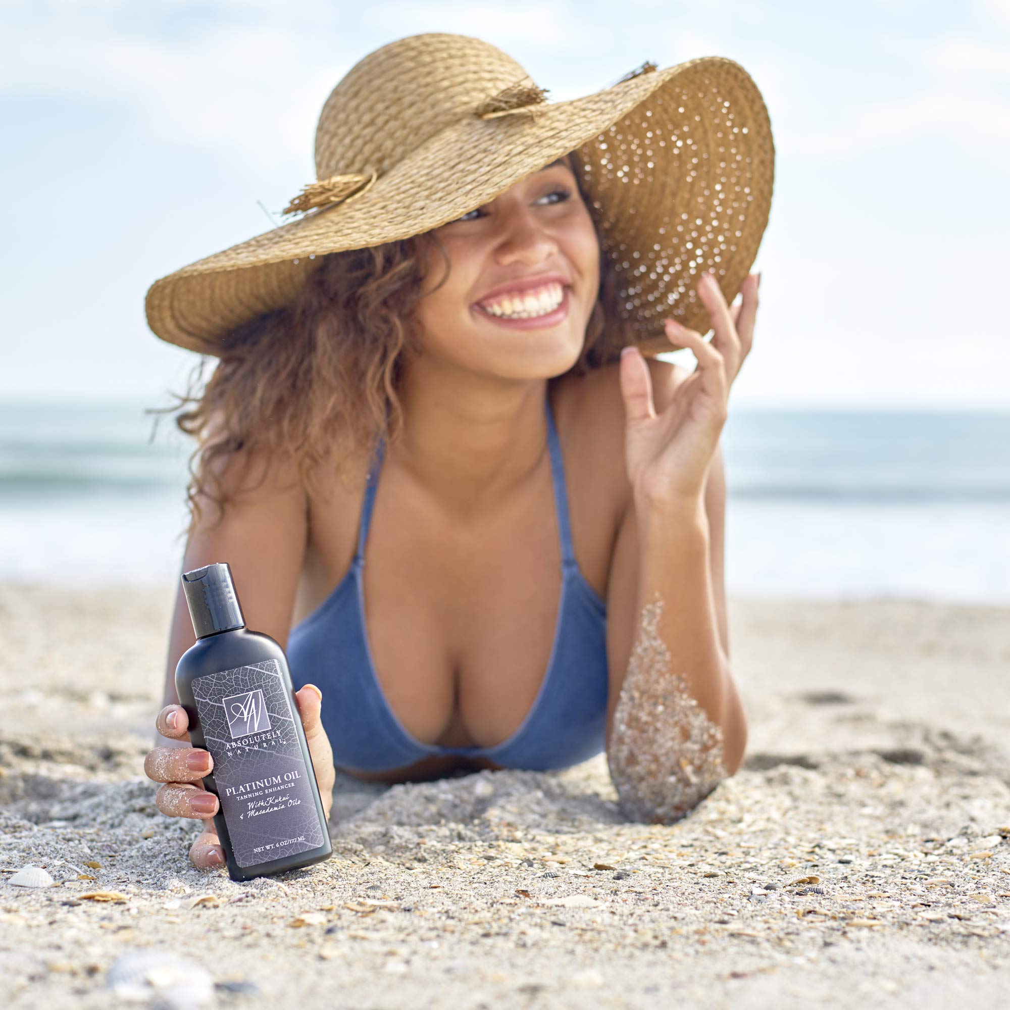 Absolutely Natural tanning oil aloe and squalane hydrate skin.