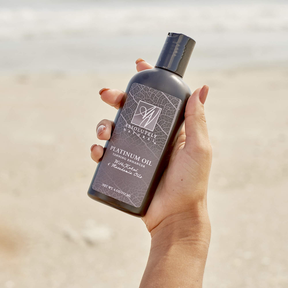 Absolutely Natural tanning oil spa use showcases luxurious glow.