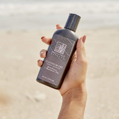 Absolutely Natural tanning oil spa use showcases luxurious glow.