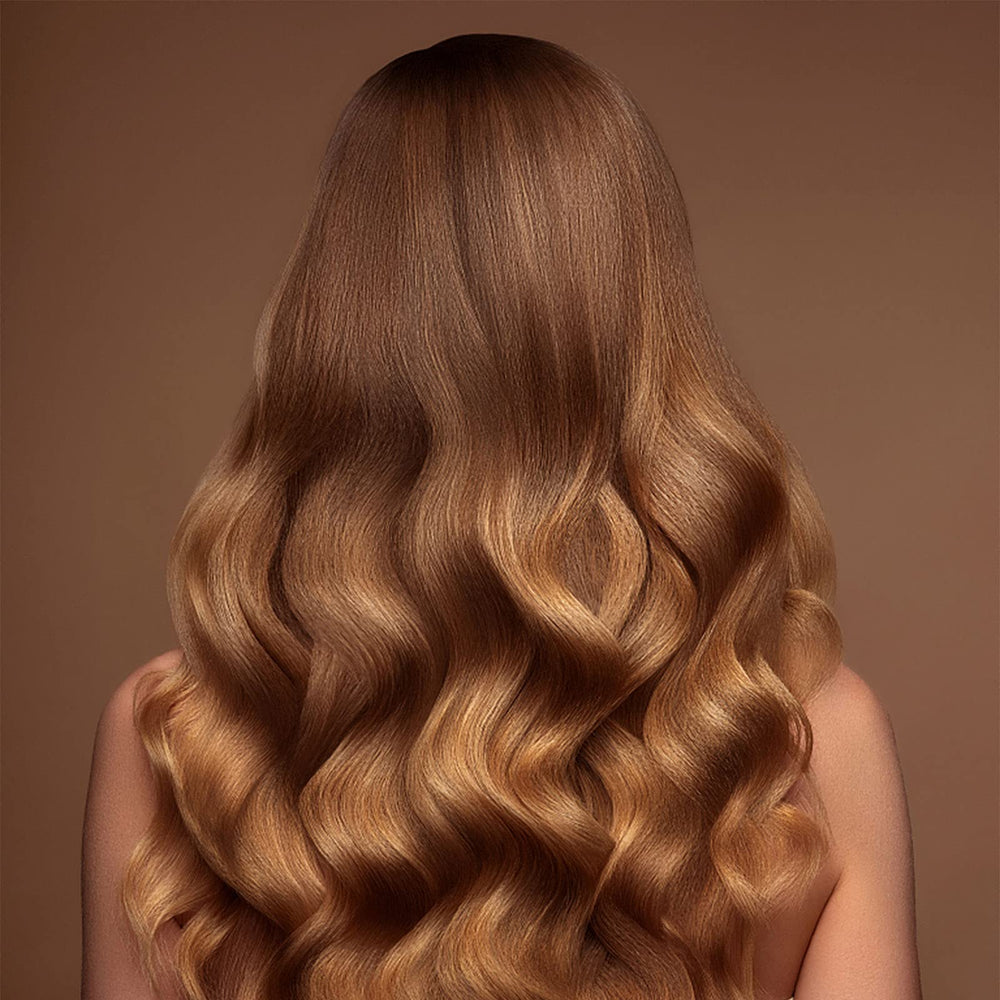 Acomler hair wax color streak appears on the strand.