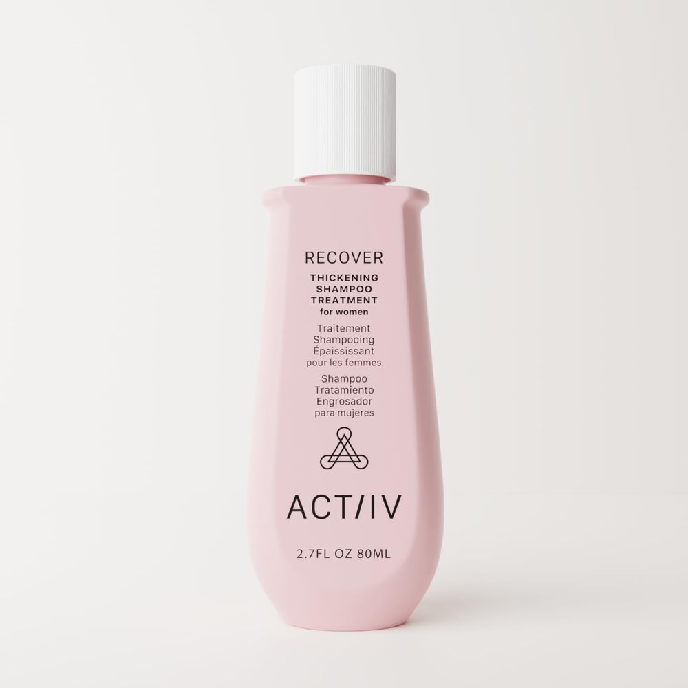 Rich lather from ACTIIV Recover thickening shampoo on a hand shows cleansing action.