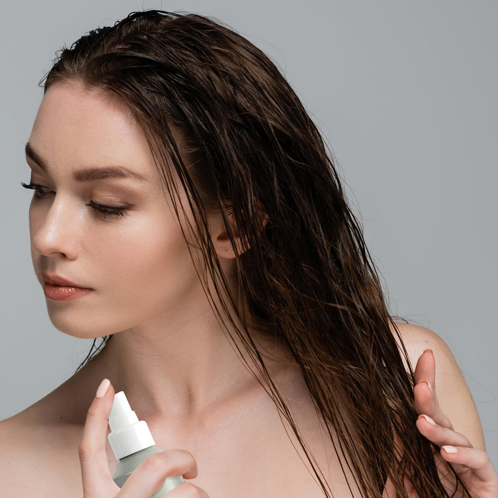 Acure Bonding Leave-In bottle highlights vegan, sulfate-free formula for all hair types.