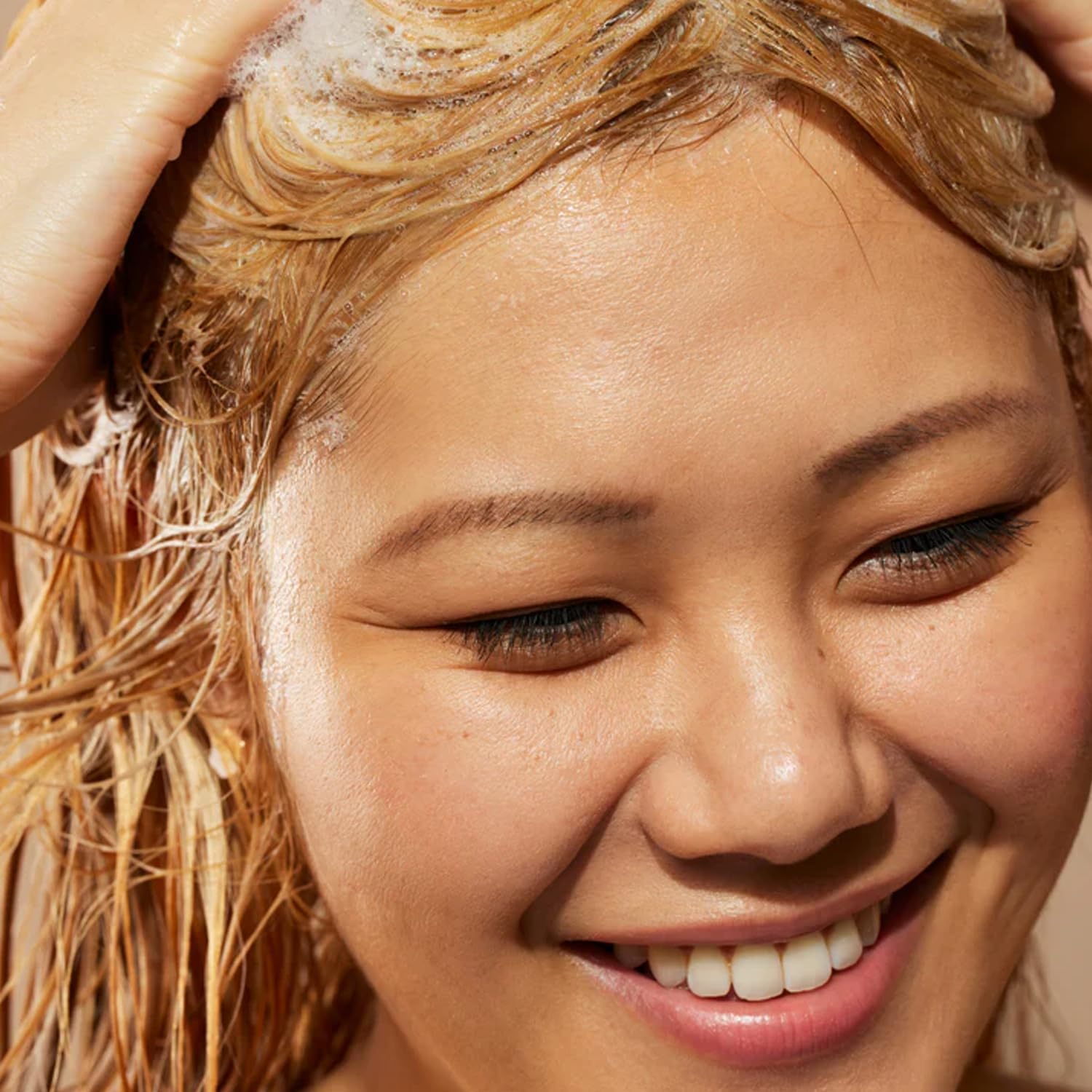 Acure Conditioner mid-length to ends application shows even coverage.