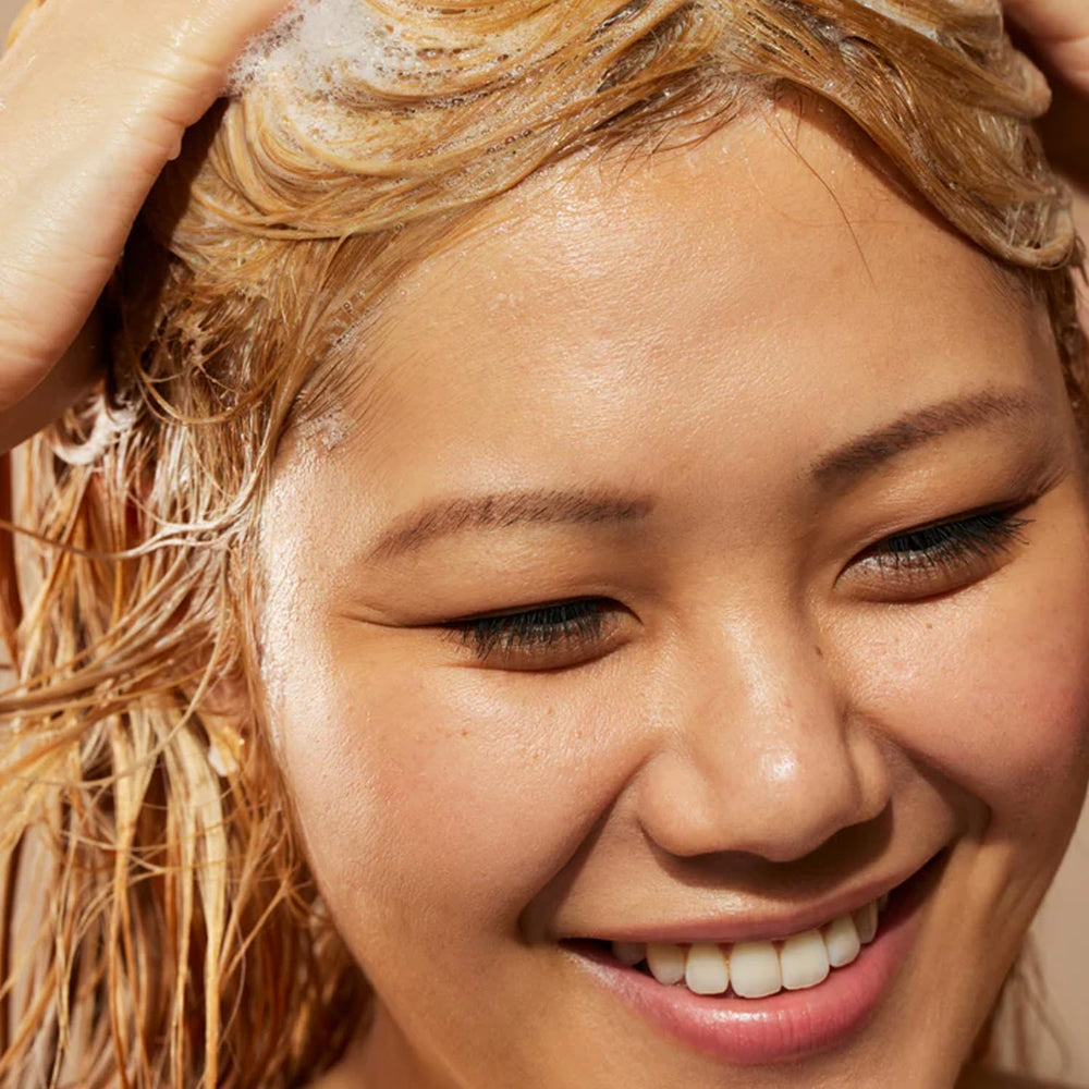 Acure Conditioner mid-length to ends application shows even coverage.