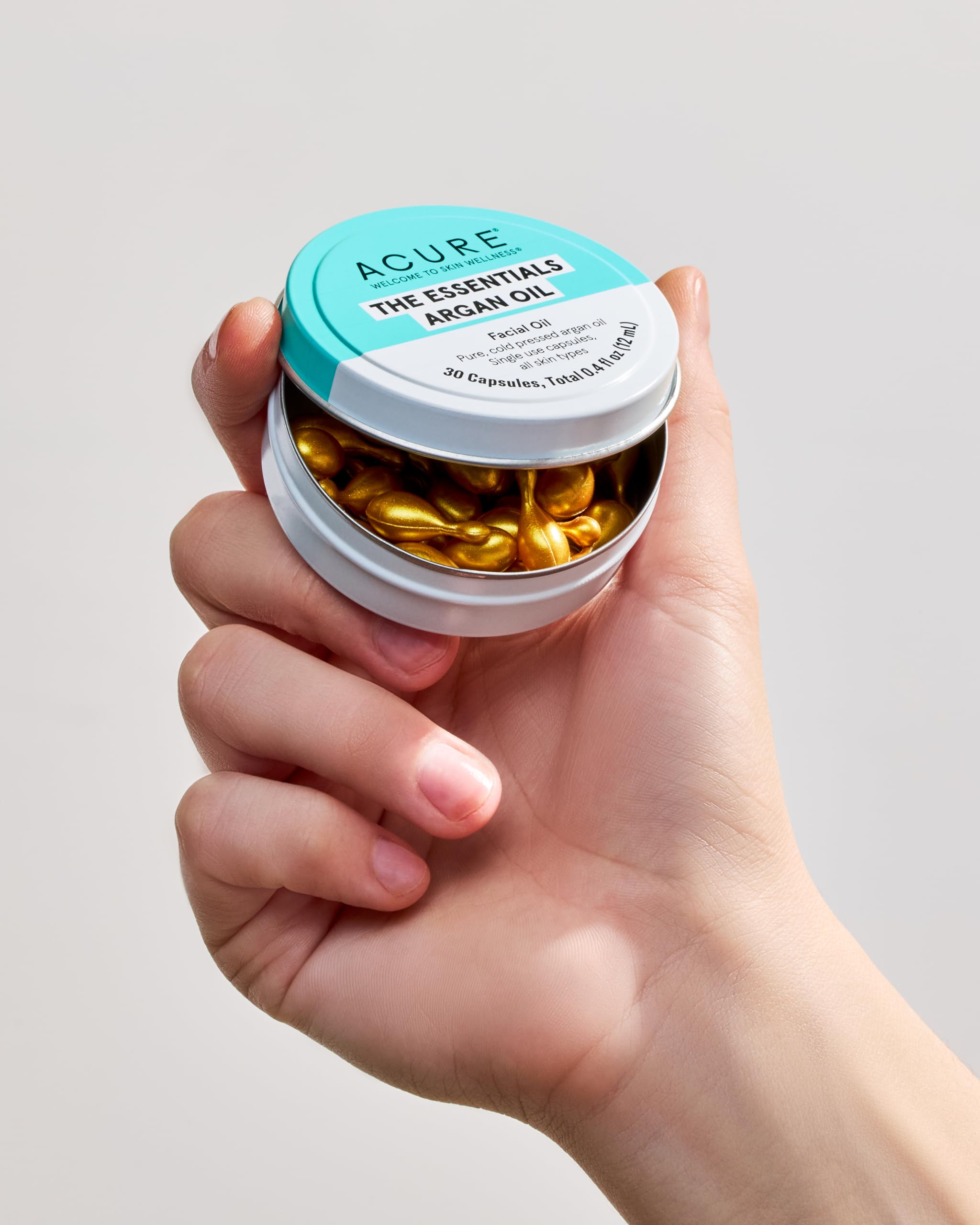Acure Argan Oil Capsules close-up showing pure oil texture.