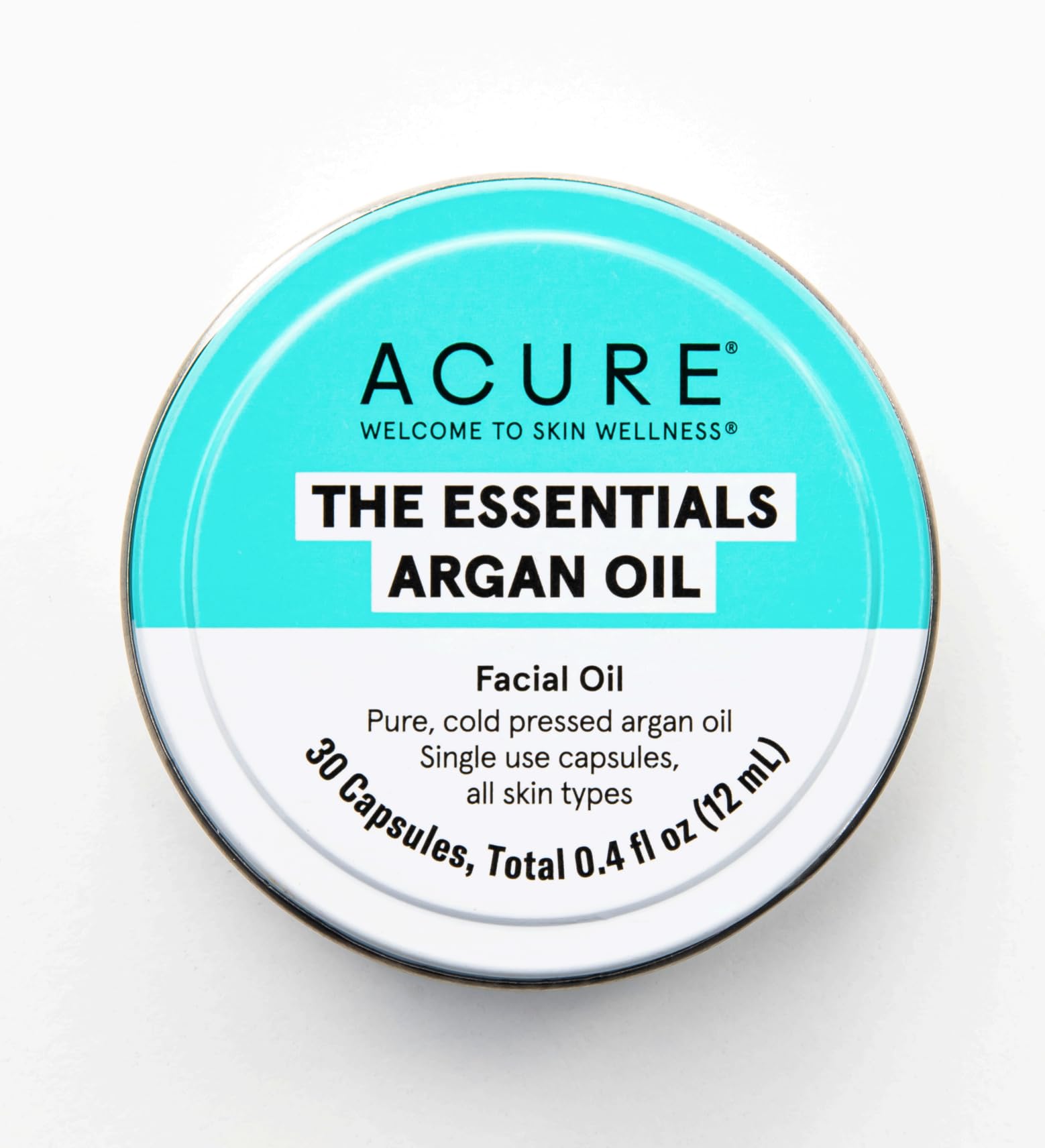 Acure The Essentials Argan Oil Capsules on a reusable tin for travel.