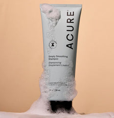 Acure Shampoo foam close-up demonstrates gentle cleansing.