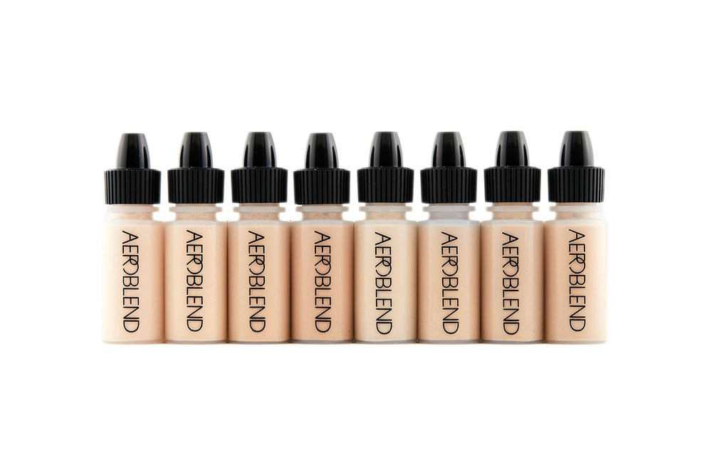 Aeroblend airbrush mini set light shows eight bottles for lightweight coverage.