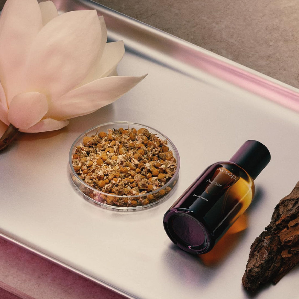 Aesop Aurner spray on wrist suggests light daytime wear.