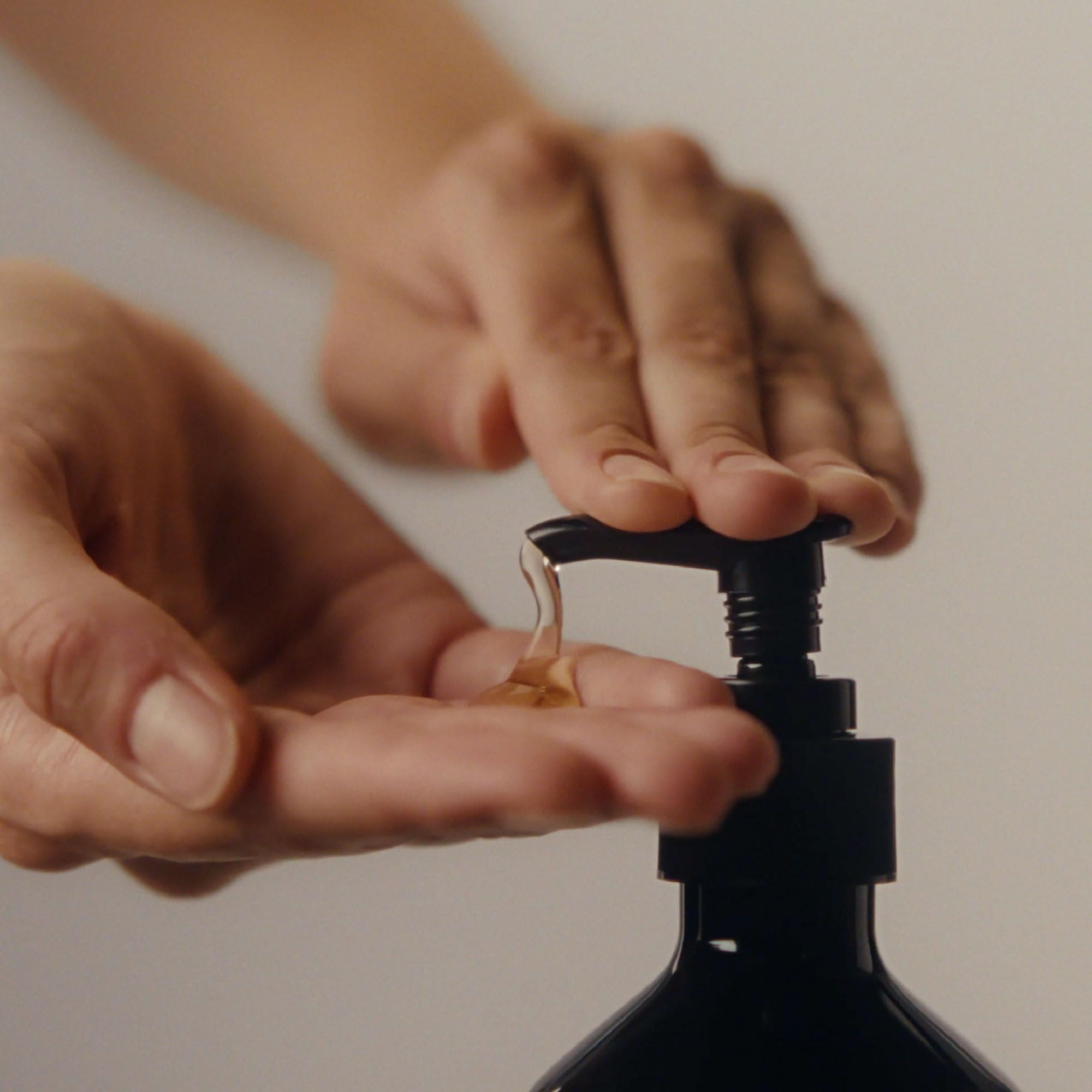 Aesop Cardamom and Black Pepper essence image suggesting vibrant fragrance.