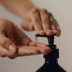 Aesop Coriander Seed Body Cleanser patchouli and coriander ingredients highlighted up close.