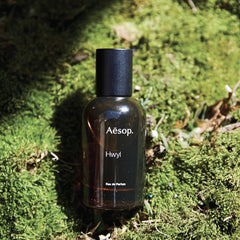 Aesop Hwyl wood-tones table scene highlights earthy, woody character