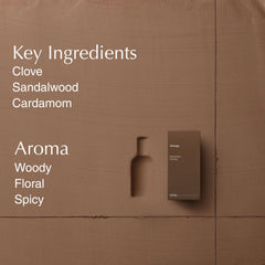 Aesop Marrakech Intense bottle on wood surface, ideal for a refined vanity.