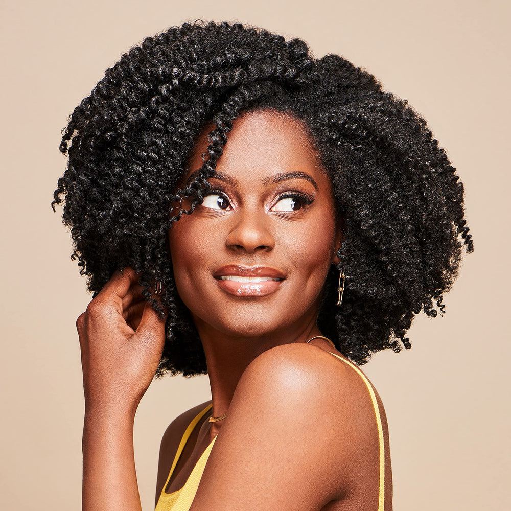 African Pride Moisture Miracle hair application demonstrates smooth coils