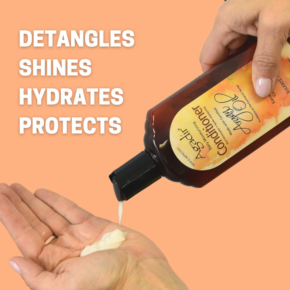 Agadir Argan Oil Daily Moisturizing Conditioner closeup texture showing creamy consistency.