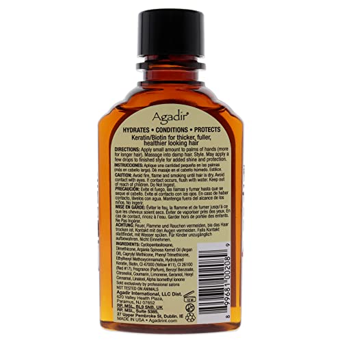 Agadir Argan Oil Hair Treatment being poured shows easy application.