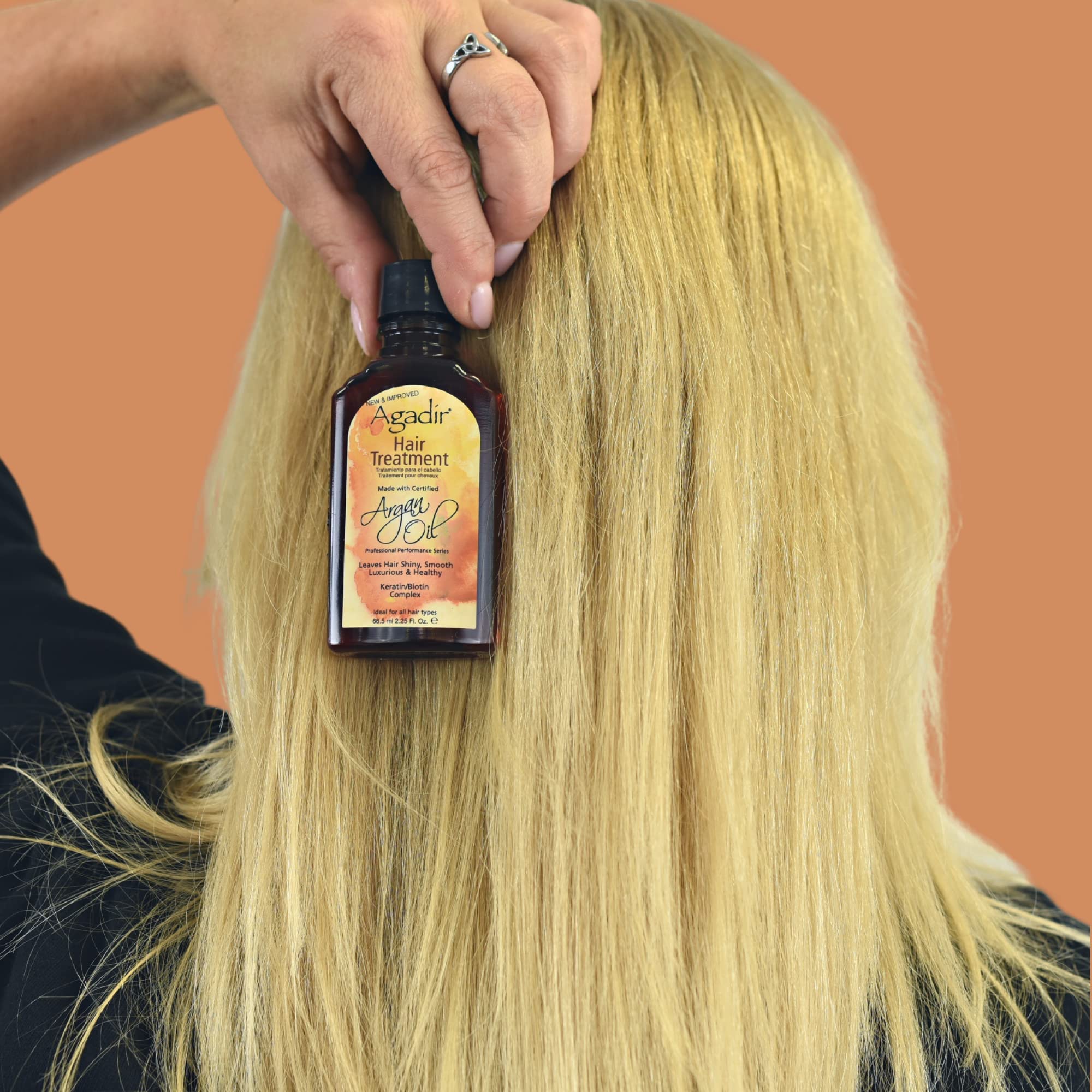Agadir Argan Oil Hair Treatment application on scalp nourishes dry areas.
