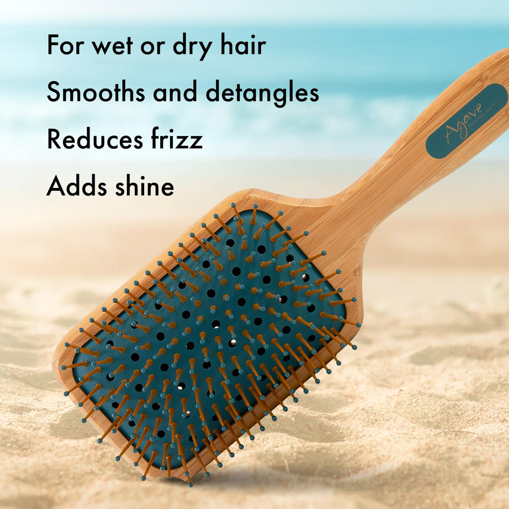 Agave Healing Oil bamboo paddle brush damp hair use demonstrates smoothing.