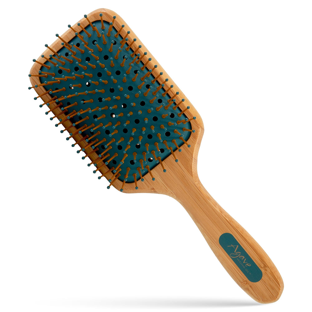 The Agave Healing Oil bamboo paddle brush front view shows smooth detangling.