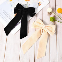Aileam velvet bow worn in hair for polished everyday look