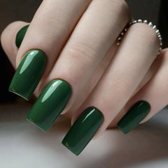 AILLSA swatch on nail shows deep emerald color with high gloss.