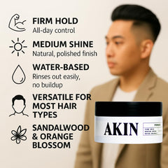 Close-up of AKIN Official Pomade jar highlighting flake-free hold