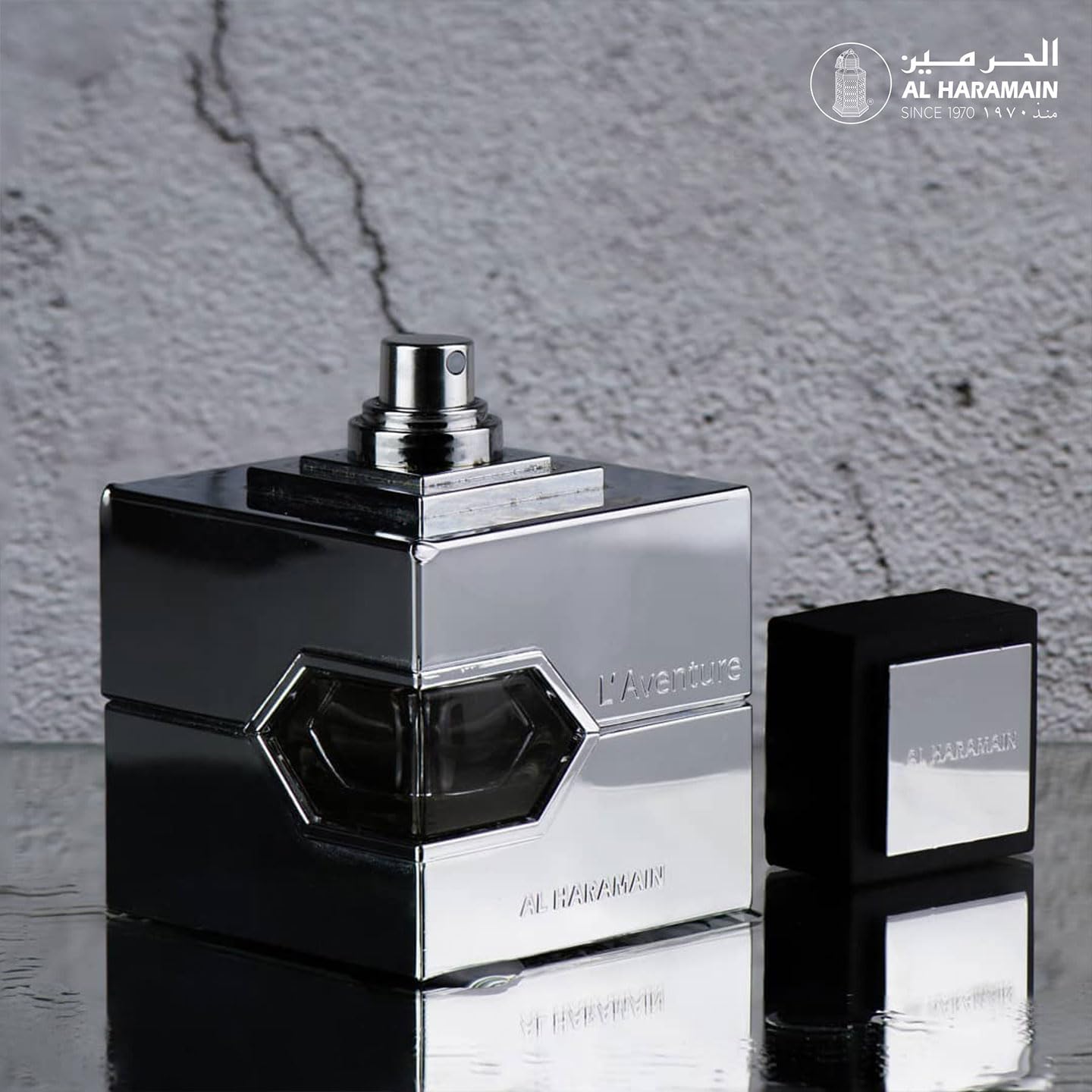 Al Haramain L'aventure bottle label close-up showing jasmine and lily notes