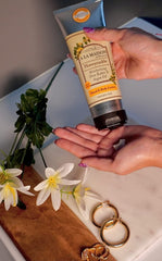 A LA MAISON honeysuckle lotion texture close-up shows non-greasy hydration.
