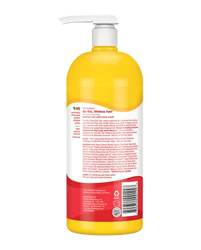 Hands applying Alba Botanica Mango conditioner, detangles and adds gentle shine.