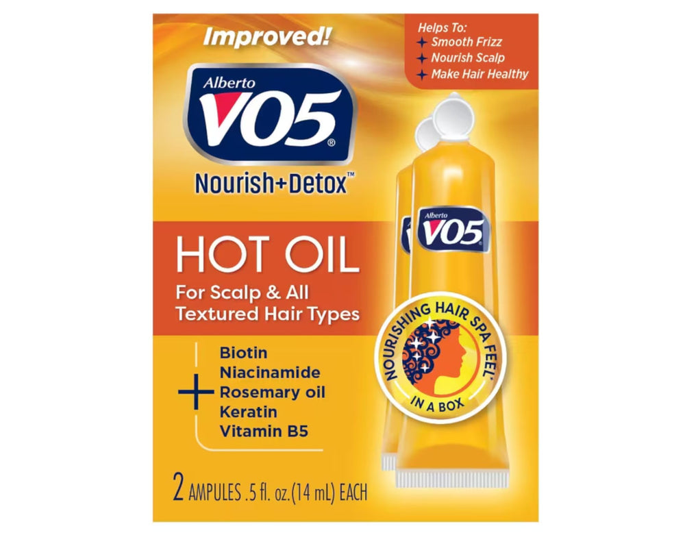Alberto VO5 Hot Oil Therapy bottle pour for shiny, hydrated hair.