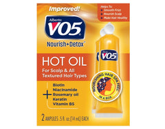Alberto VO5 Hot Oil Therapy bottle pour for shiny, hydrated hair.