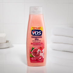 Alberto VO5 Pomegranate Bliss conditioner tube showcasing fruity fragrance and soft, manageable hair.