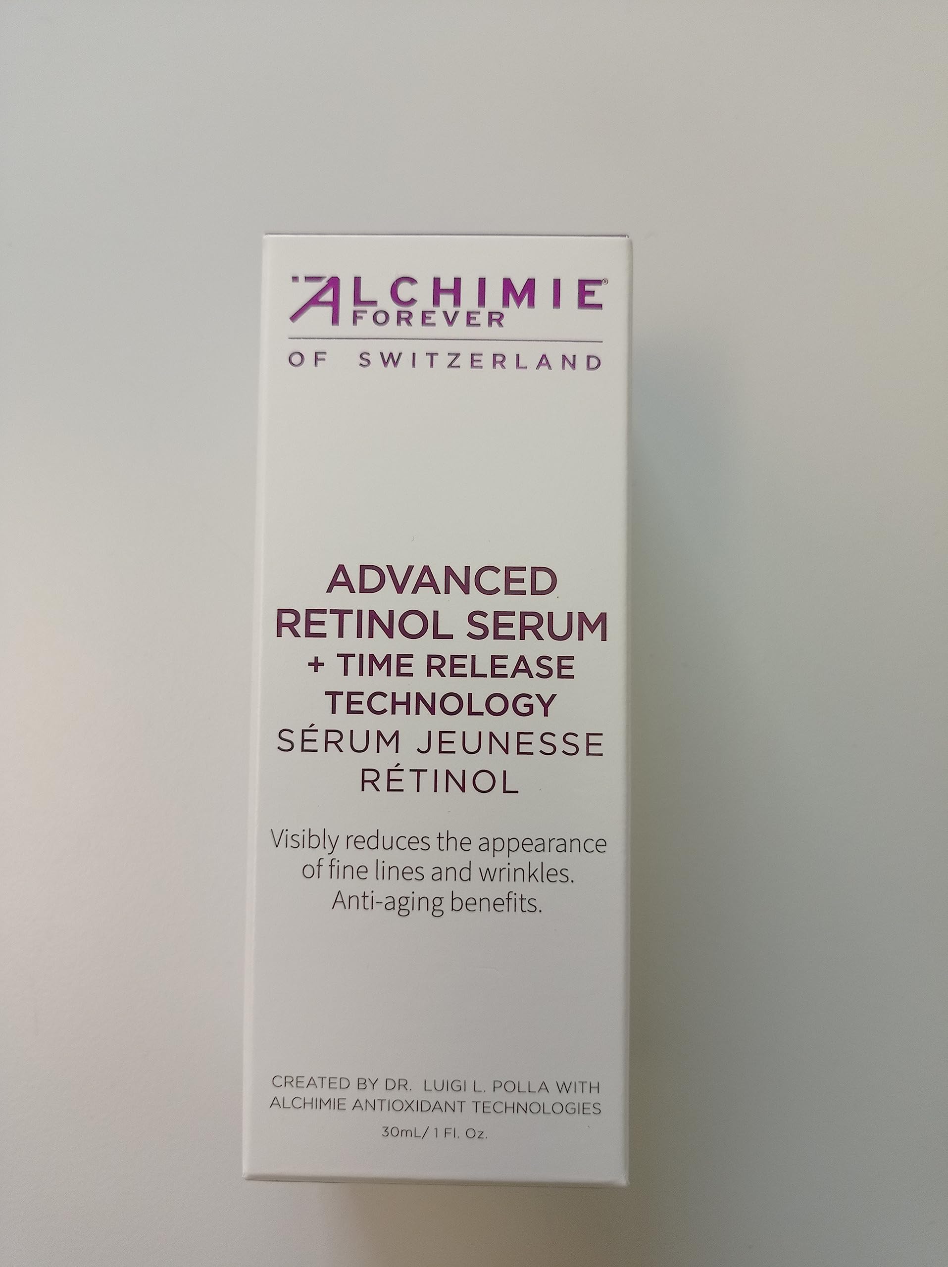 Alchimie Forever packaging in glass bottle on vanity for premium skincare