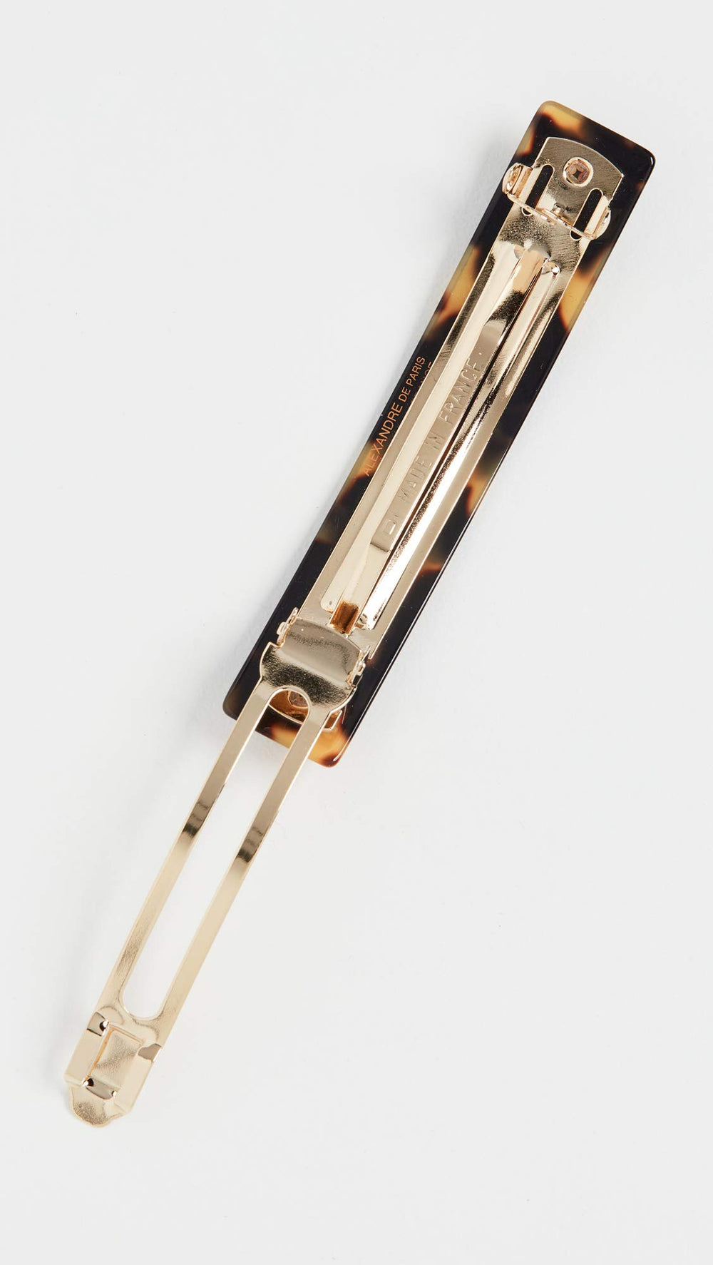 Alexandre de Paris Tokyo tortoise hair clip worn in casual updo for easy style