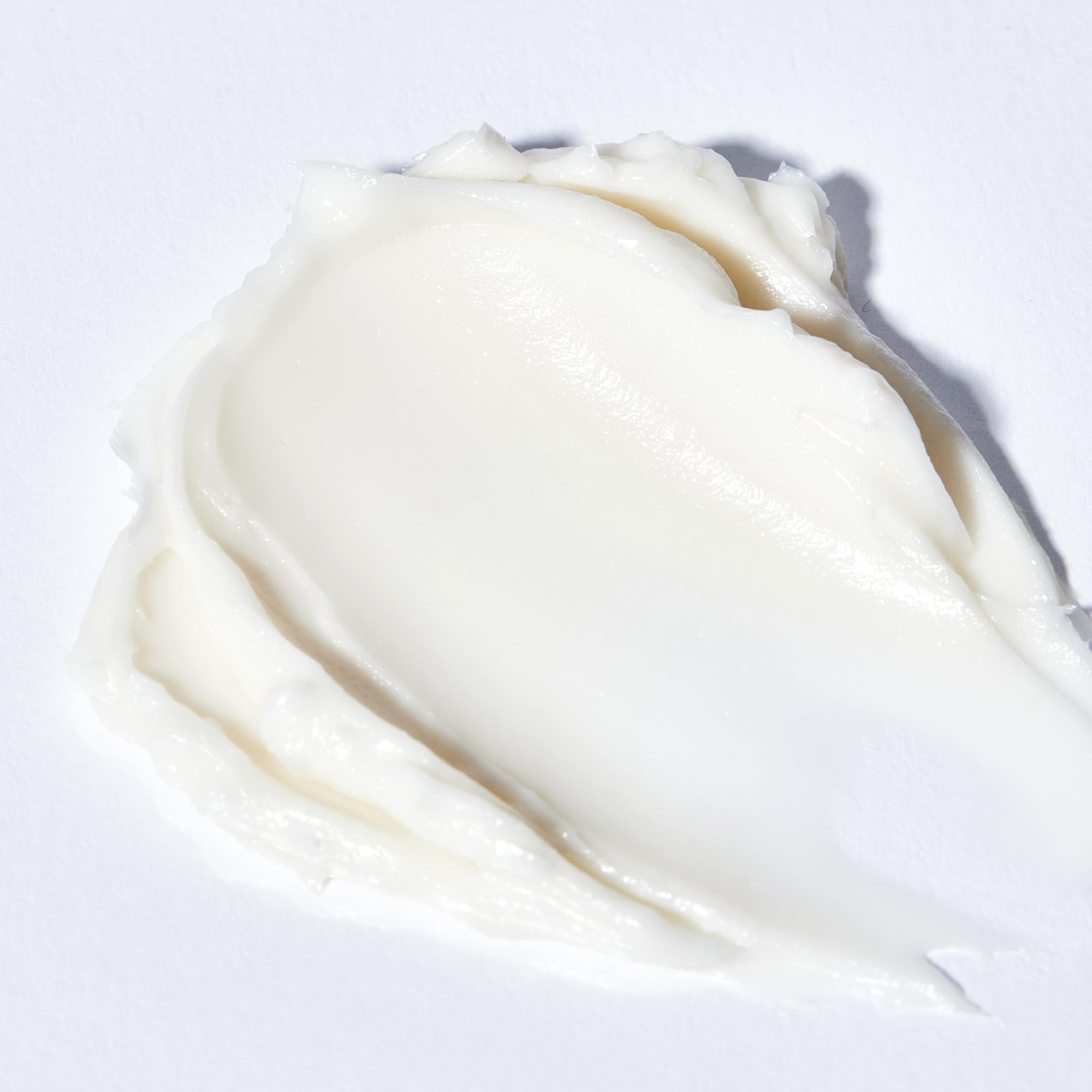 Algenist Genius Sleeping Collagen Night Cream application close-up demonstrates creamy texture.