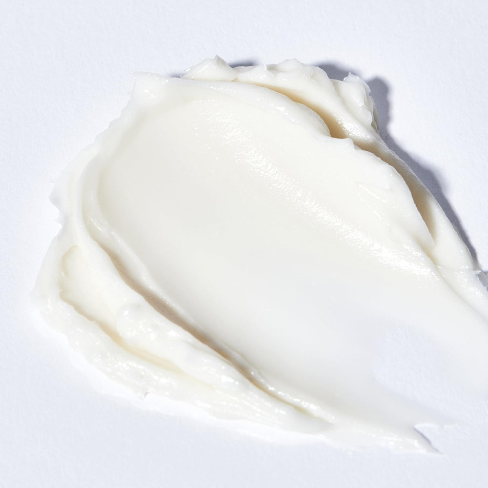 Algenist Genius Sleeping Collagen Night Cream application close-up demonstrates creamy texture.