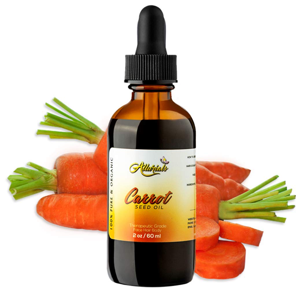 Allurials carrot seed oil bottle closeup with rich golden oil for skin and hair care.