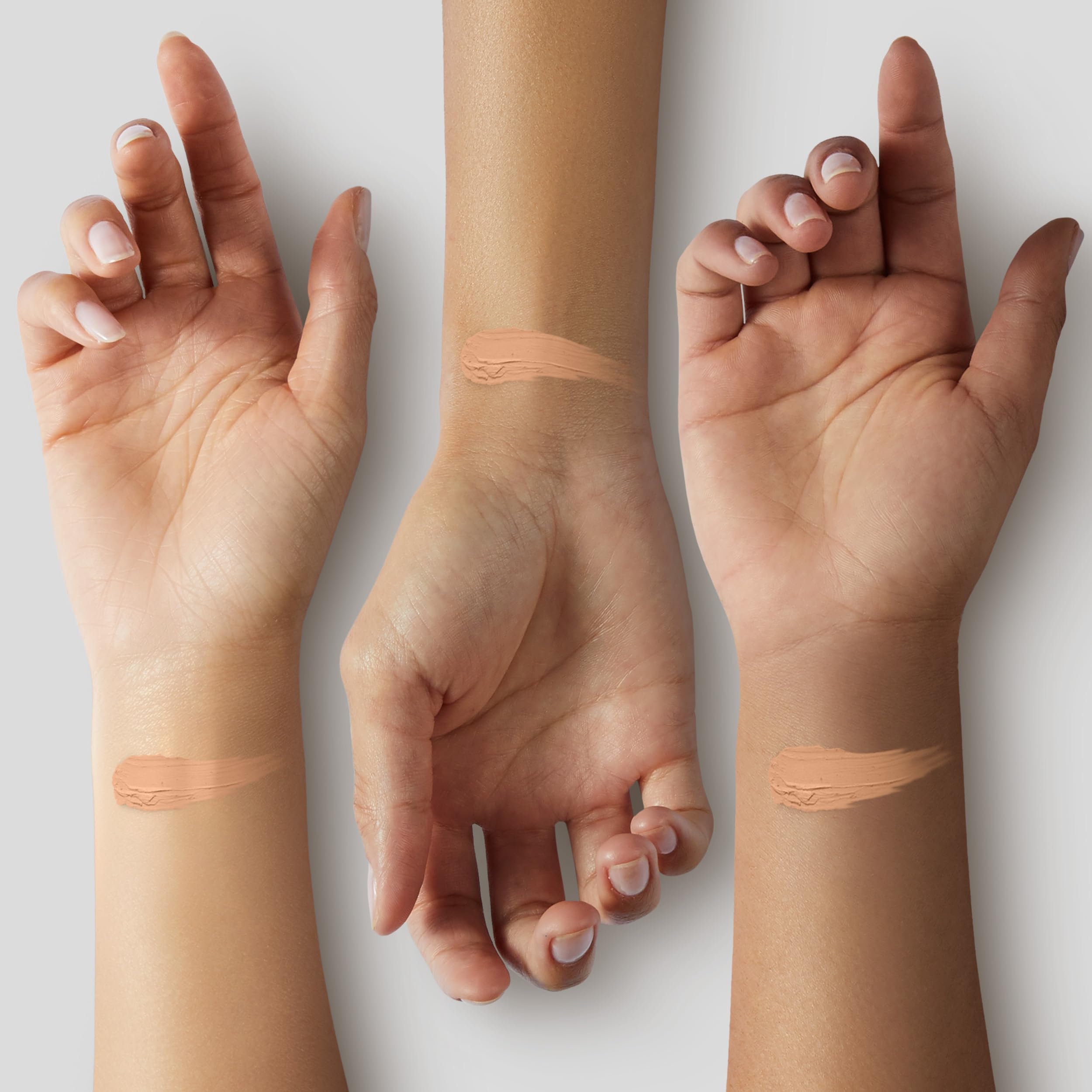 Model applying Almay Clear Complexion foundation showcasing blendable texture