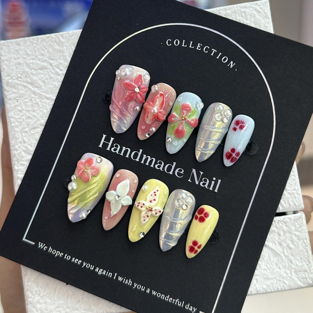 Almond medium nails with gradient and floral patterns for versatile style.