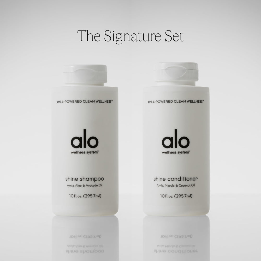 Creamy lather forming as Alo Shine Shampoo cleanses without sulfates.