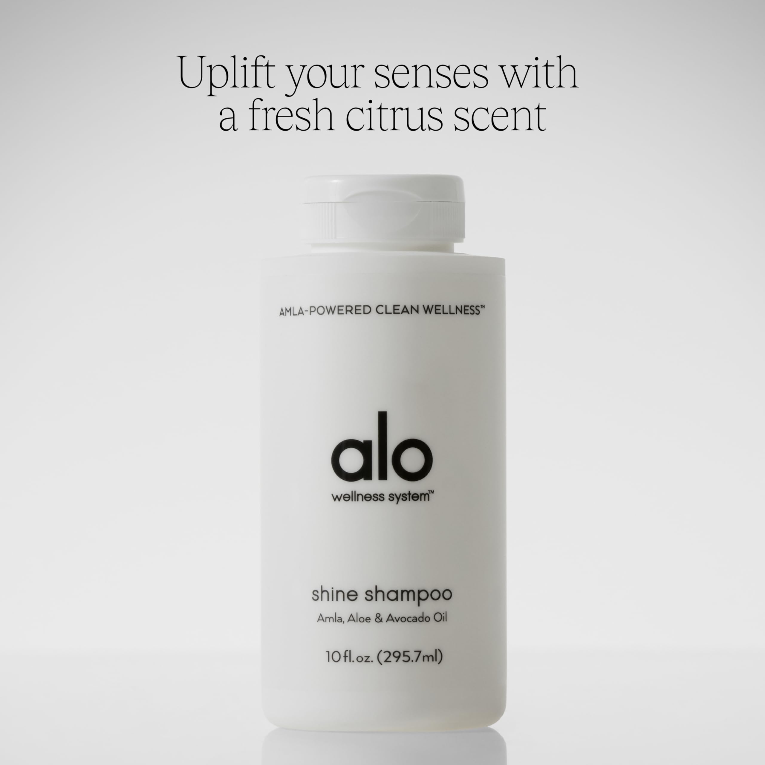 Grapefruit scent indicated on Alo Shine Shampoo packaging for a refreshing cleanse.