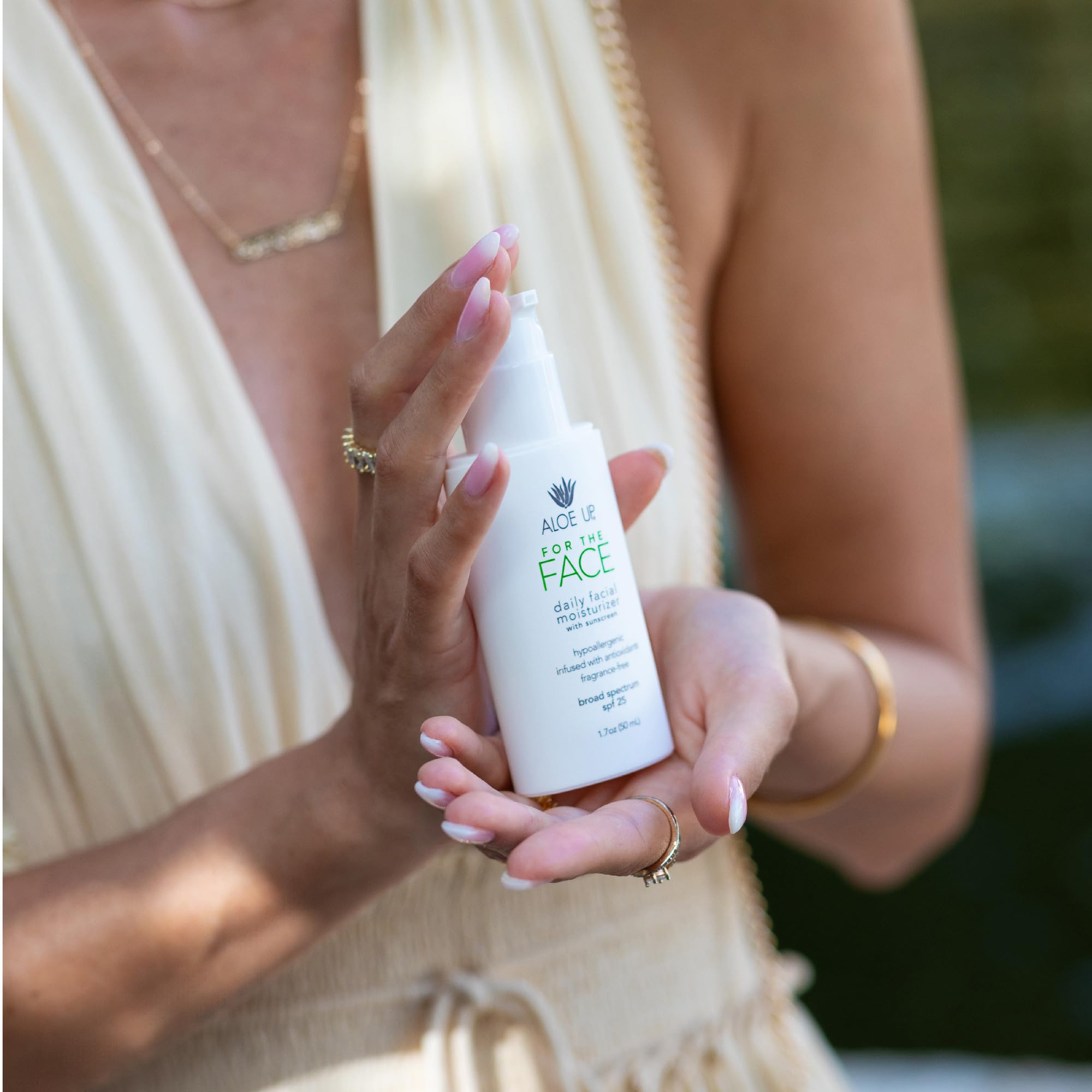 Aloe Up reef-friendly sunscreen branding on packaging for responsible sun care.