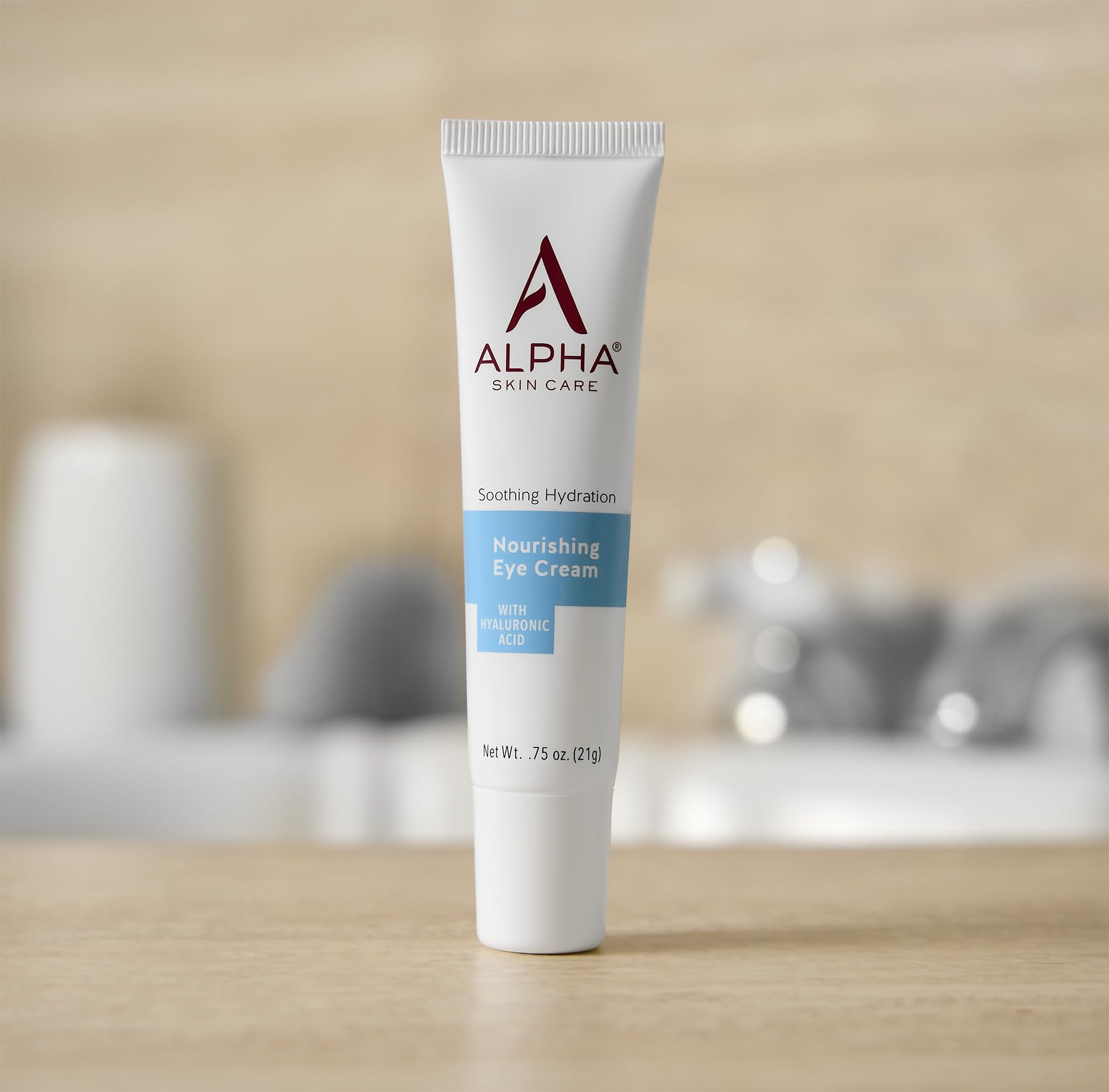 Application of Alpha Skin Care eye cream with hyaluronic acid for smooth, quick absorption around the eyes.
