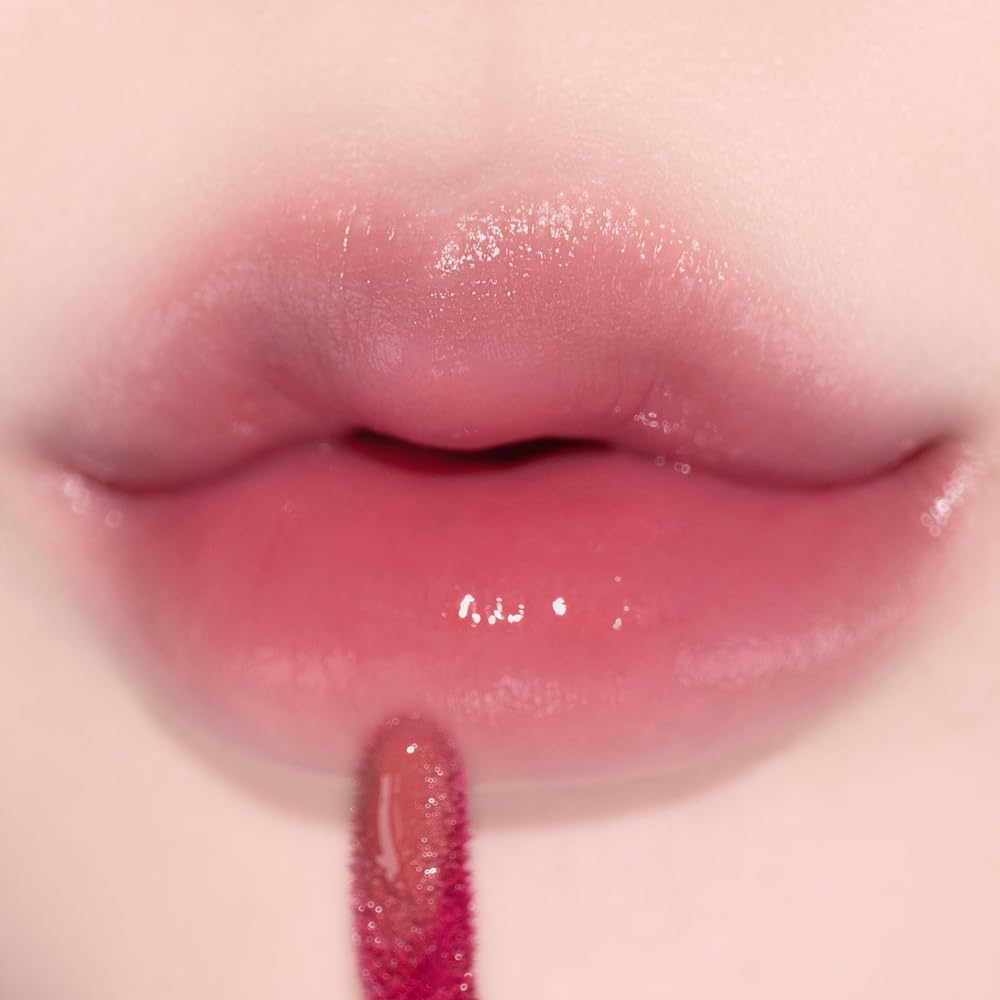 Alternativestereo Lip Potion Aqua Glow No.2 Fig Candy swatch with warm color and subtle shine.