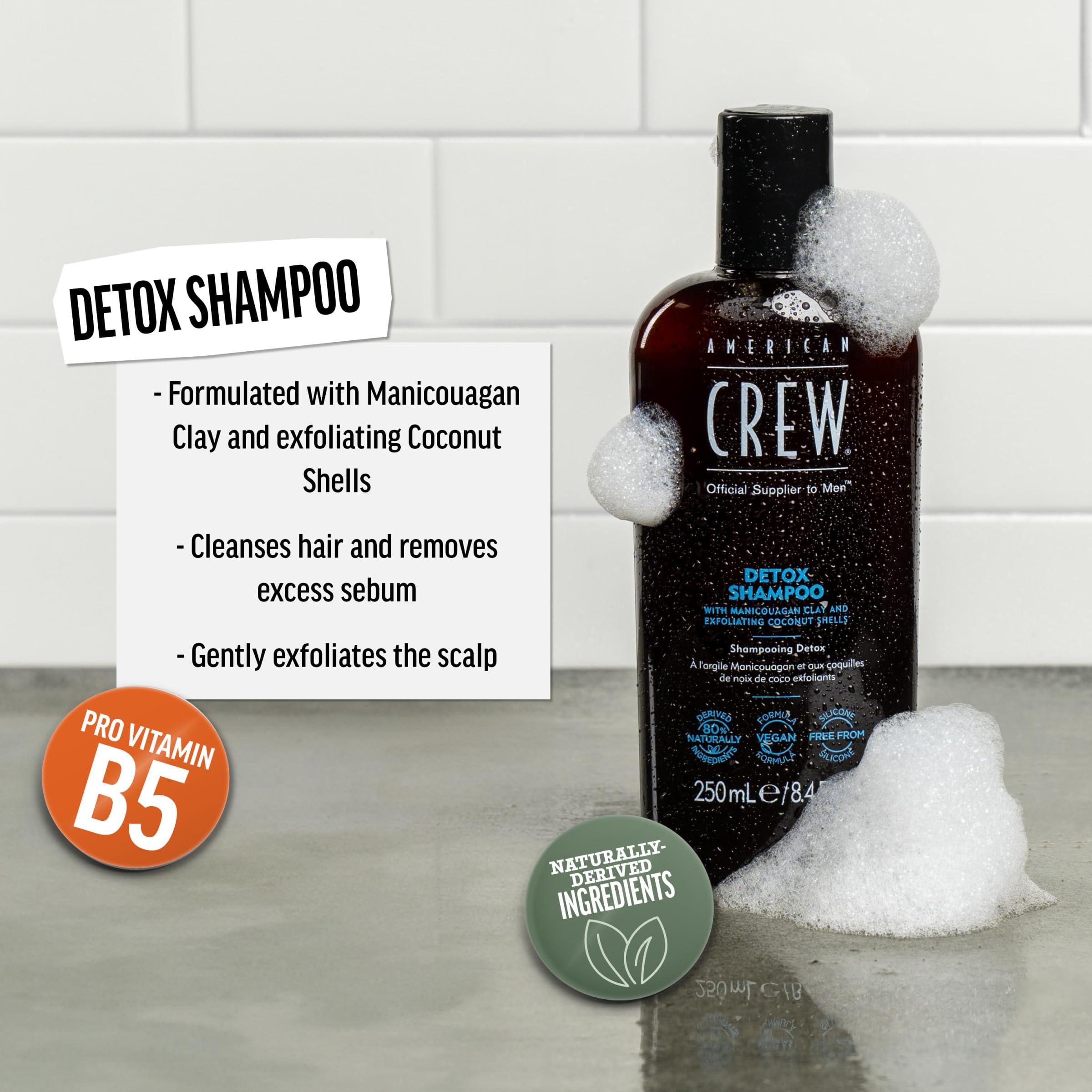 American Crew Detox Shampoo lather on hand shows exfoliating cleansing action for buildup-free hair