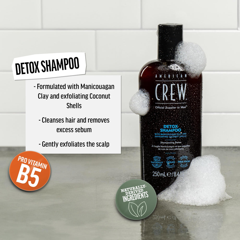 American Crew Detox Shampoo lather on hand shows exfoliating cleansing action for buildup-free hair