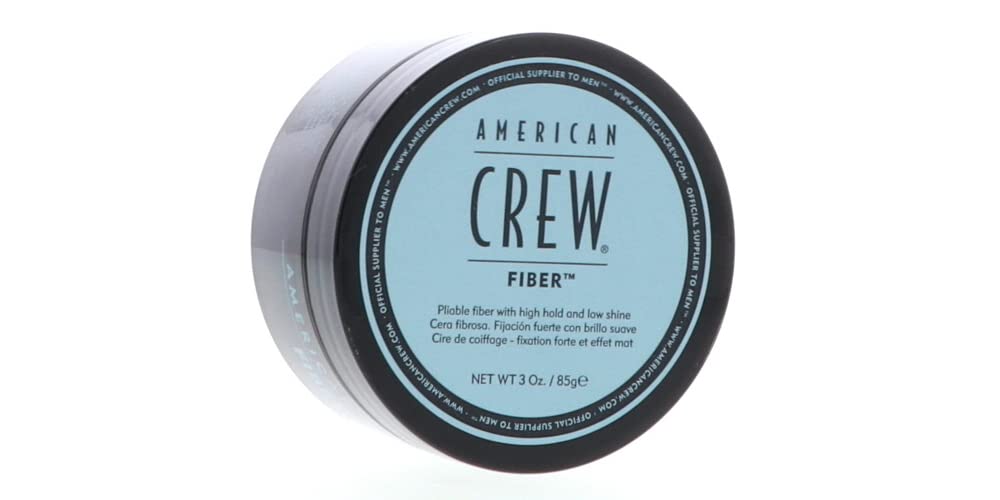 American Crew Men Fiber hands applying cream for styling.