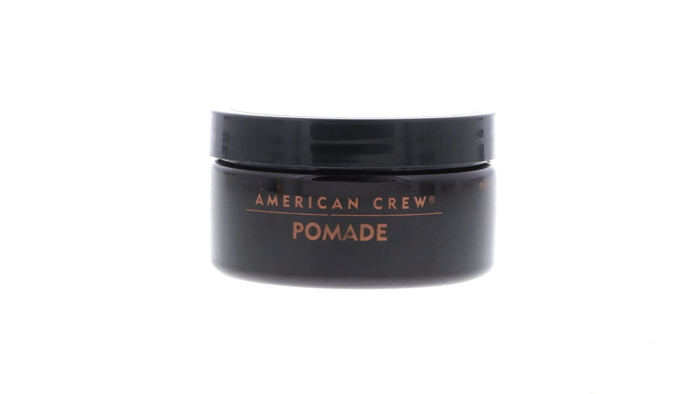 Hair slick-back with American Crew Pomade achieving a glossy finish.