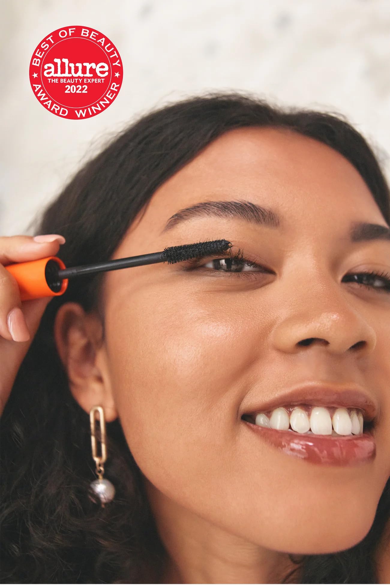 Application process image showing gradual layering with AMI COLÉ mascara.