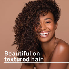 AmPro Long-Aid Activator Gel hands-application shows easy styling for frizz-prone hair.